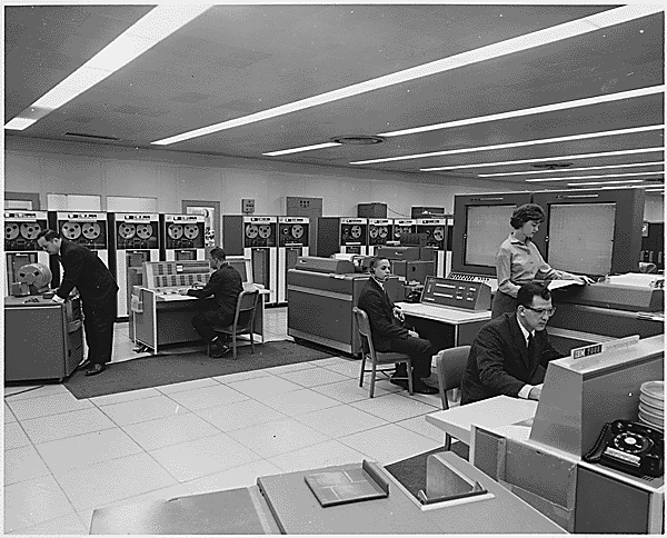 NASA IBM 7090 computer room with rows of mainframe cabinets.