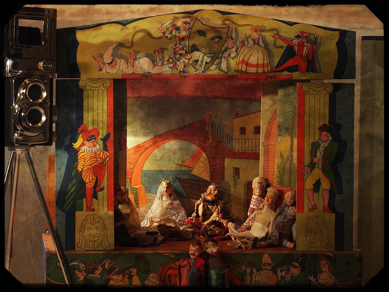 A marionette theatre with puppets suspended and controlled by strings from above.