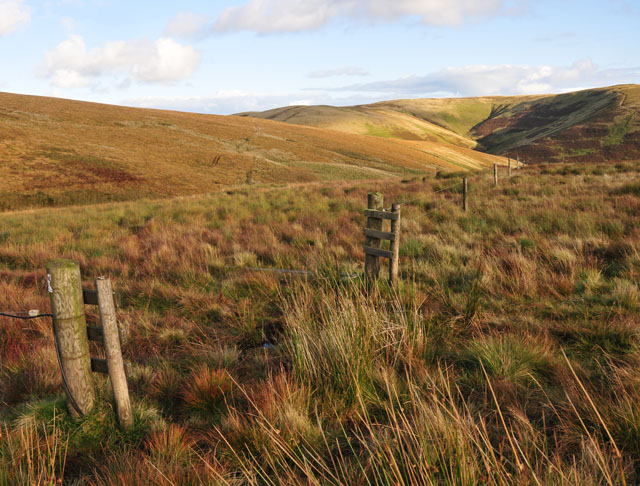 An open gate in an electric fence line.