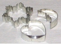 A set of metal cookie cutters in various shapes.