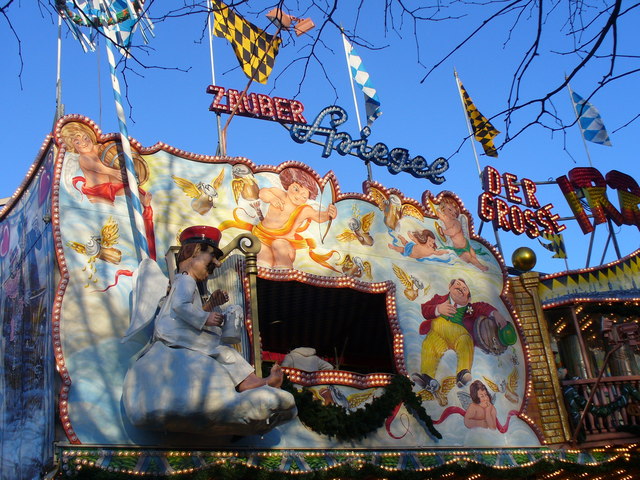A fairground house of mirrors with distorted reflections.