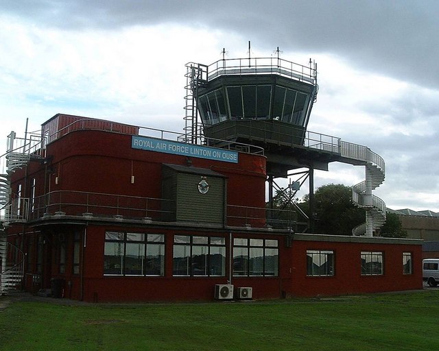 An air traffic control room with operators watching screens.